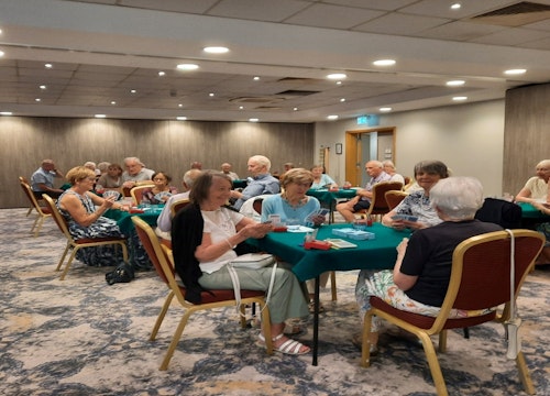 Guests playing bridge in the Trinity Suite
